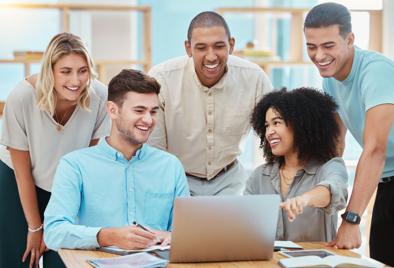 Group of people looking at laptop
